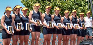 Members of Ithaca's 2004 national champion crew celebrate the program's first NCAA title on the award stand.